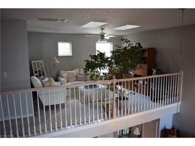 Balcony Sitting Area with two skylights.