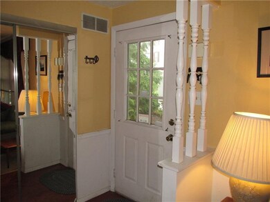 The entryway has a generous closet with mirrored d
