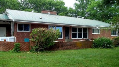 A large patio with brick surround is in the rear of this wonderful home.