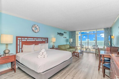 Bedroom with crown molding, light wood-type floori
