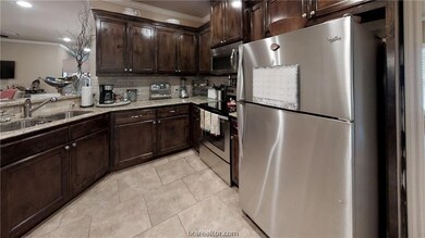 Beautiful kitchen features granite countertops
