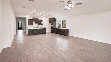 Kitchen with open floor plan, a sink, light count