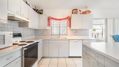 Step-saving kitchen has plenty of cabinets and cou