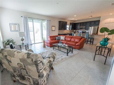 Where the kitchen meets the great room....Large over size sliding door lead out to a cover patio.