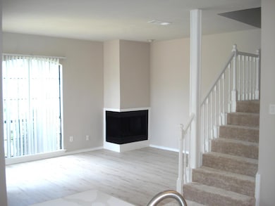 Stairs featuring hardwood / wood-style flooring an