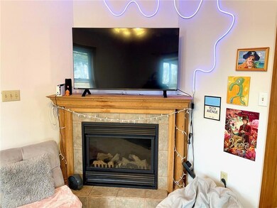 Gas fireplace located in the living room space.