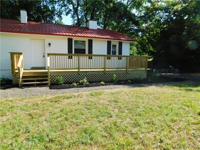 View of front of property featuring a wooden deck
