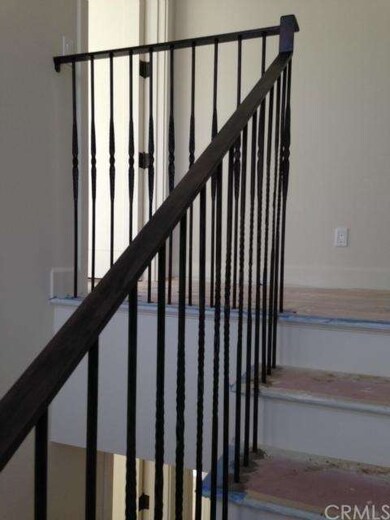 Stair railings are burnished wrought iron and look