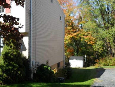 Exterior Front. Right side of house showing A/C un