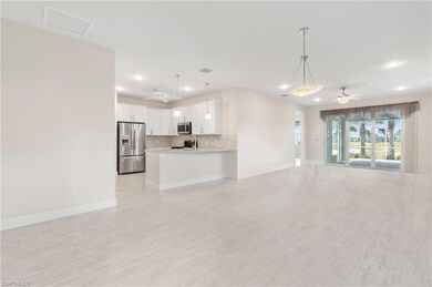 Unfurnished living room featuring baseboards, visi