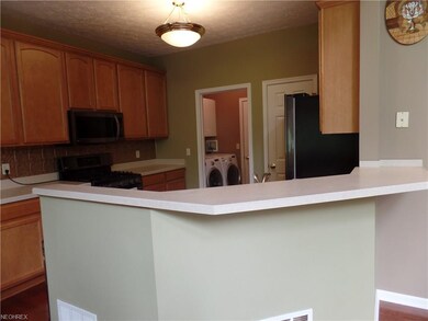 Kitchen with breakfast bar. All appliances stay, i