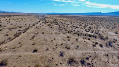 Birds eye view of property with a mountain view and a desert view