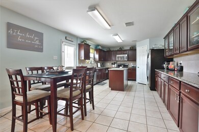 Spacious eat in kitchen area, island, and tons of