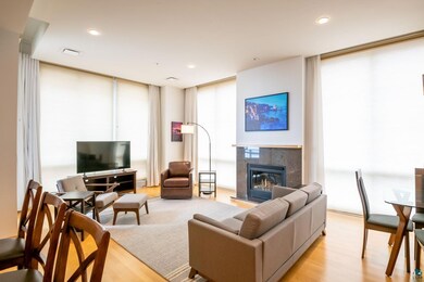 Living room with light hardwood / wood-style floor