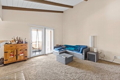 Carpeted living room featuring newer carpet and hi