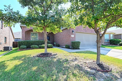 Obstructed view of property with brick siding, driveway, and an attached garage
