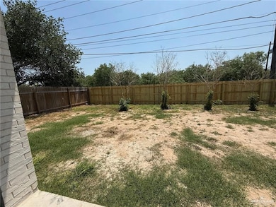View of fenced backyard