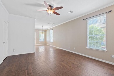 Empty room featuring a chandelier, a ceiling fan,