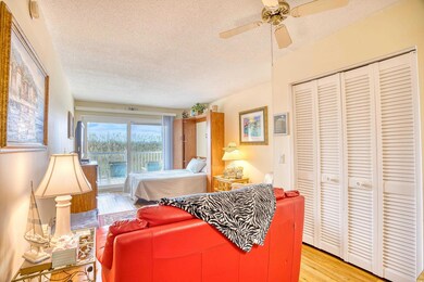 Bedroom with a textured ceiling, a closet, ceiling