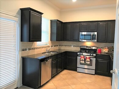 Kitchen offers stainless appliances.