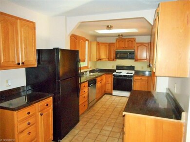 Great kitchen with ceramic tile flooring and grani