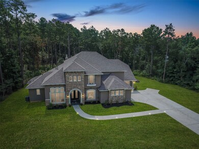 Home management is eased with low maintenance stucco and stone exterior, low E windows, radiant barrier and zoned heat and air conditioning. The three car garage and double wide driveway offers plenty of parking space.