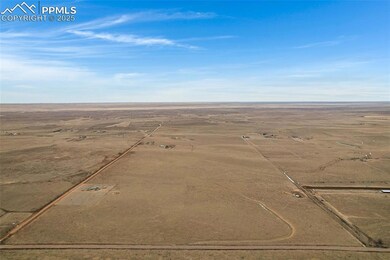 Birds eye view of property featuring a rural view
