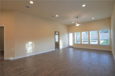 Unfurnished room featuring dark wood-type floorin