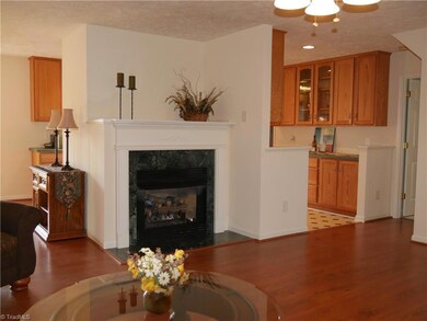 Living Room Laminate Hardwoods, Ceiling Fan, Decorative mantel with gas logs. Bright and Open