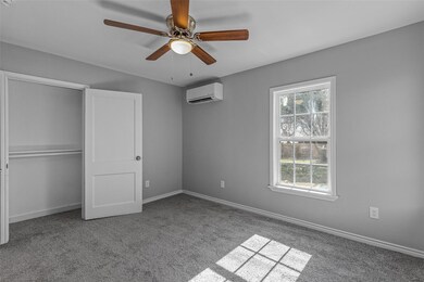 Unfurnished bedroom with a closet, ceiling fan, an