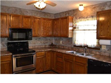 Kitchen, newer countertop, brand new Microwave. Ne