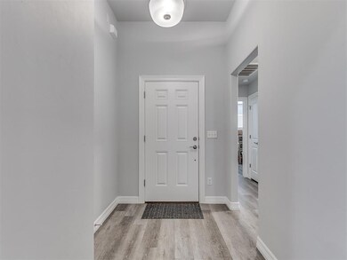 Foyer entrance featuring light hardwood