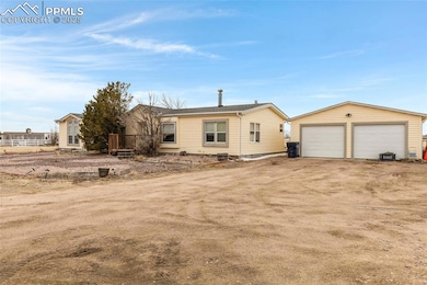 View of front facade featuring driveway, an outdoo