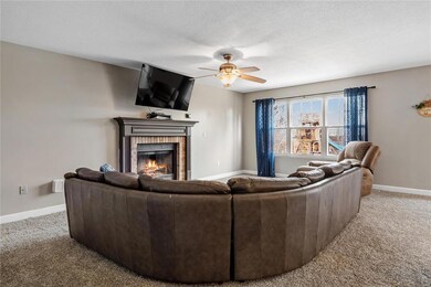 Living room view featuring wood burning fireplace 