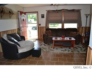 Living Room Bright Living room with tile flooring