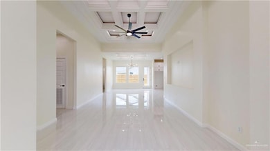 Corridor with a chandelier, coffered ceiling, beamed ceiling, and crown molding