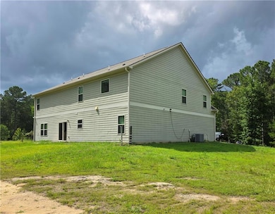 Back of property with a yard