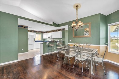 Dining space featuring a notable chandelier, wood-