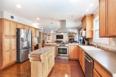 BEAUTIFUL UPDATED KITCHEN LOOKING INTO DEN