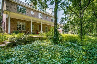 Front of the home in the natural growth in front o