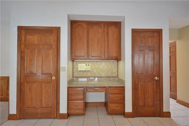 Desk area in kitchen also outfitted with granite, 