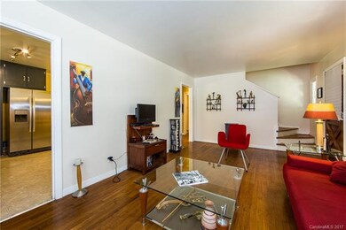 Living room with stairs to upper rooms.