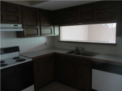 Kitchen overloooks the dining and living for easy 