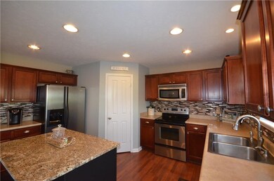 Kitchen boasts granite center island with seating!