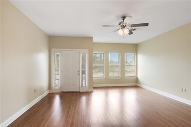 View from kitchen of living room to front door