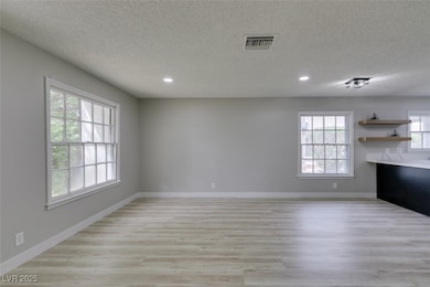 Unfurnished living room featuring recessed lightin