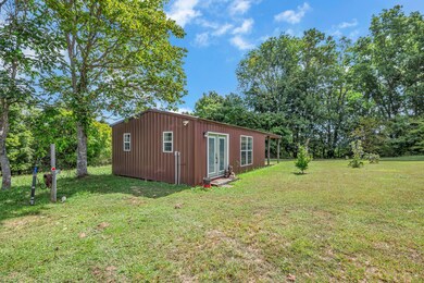 This tidy cottage has been professionally enclosed and finished out for year-round use.