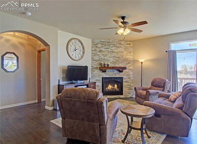 Living room has gas fireplace and walkout to the d