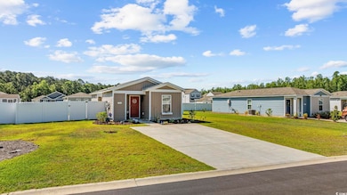 View of front of house with driveway and board and batten siding