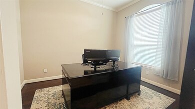 Study/office with a lot of natural light and freshly painted.